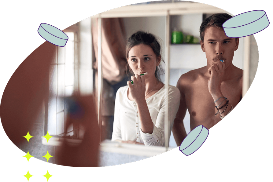 Man and woman are cleaning their teeth